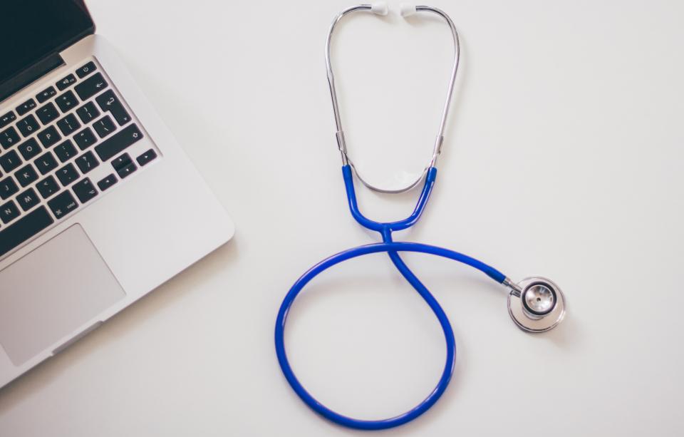 Medical stethoscope resting on a table