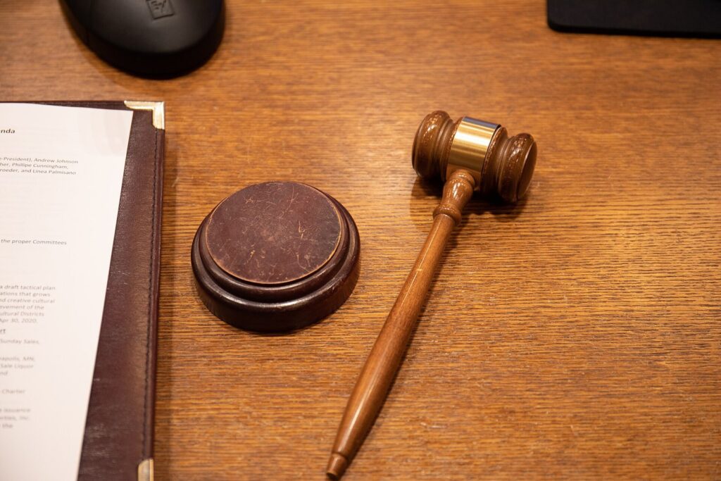 Judge's gavel on a courtroom desk