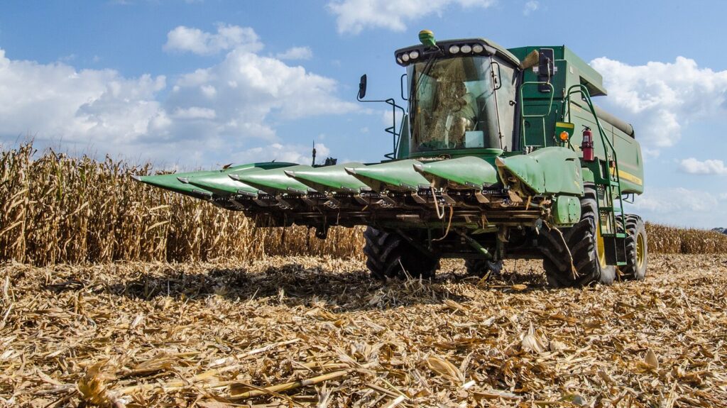 Combine harvester cutting a corn field