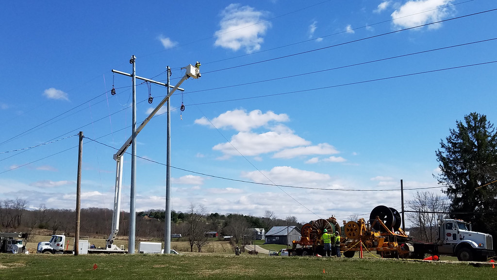 Utility crew working on power lines with a bucket truck